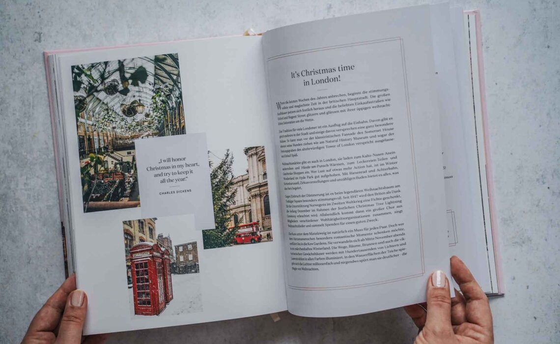Das Kochbuch London Love Story – Rezepte und Geschichten von Anne-Katrin Weber, erschienen im Hölker Verlag. Das Bild zeigt eine Doppelseite zum Thema It's Christmas time in London mit Text auf der rechten Seite und Bildern auf der linken Seite, die den weihnachtlich geschmückten Apple Market in Covent Garden zeigen, rote Londoner Telefonzellen im Schnee und einen typischen roten Doppeldeckerbus vor einem historischen Sandsteingebäude und einem Weihnachtsbaum im Vordergrund. In der Mitte befindet sich ein Zitat von Charles Dickens: I will honour Christmas in my heart, and try to keep it all the year.